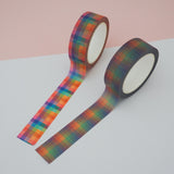 Two rolls of washi tape with a checked pattern. One is brightly coloured and the other is in dusky rainbow hues.