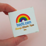 A gold foil-printed, windowed box for washi tape.