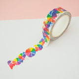 Roll of white washi tape with rainbow colour wheels in segments which change colour where they overlap. Accented with silver foil.