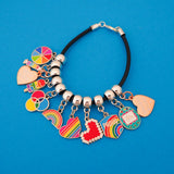 Black cord bracelet threaded with multiple enamel charms on smooth cup bail beads. Charms are of various colourful designs.