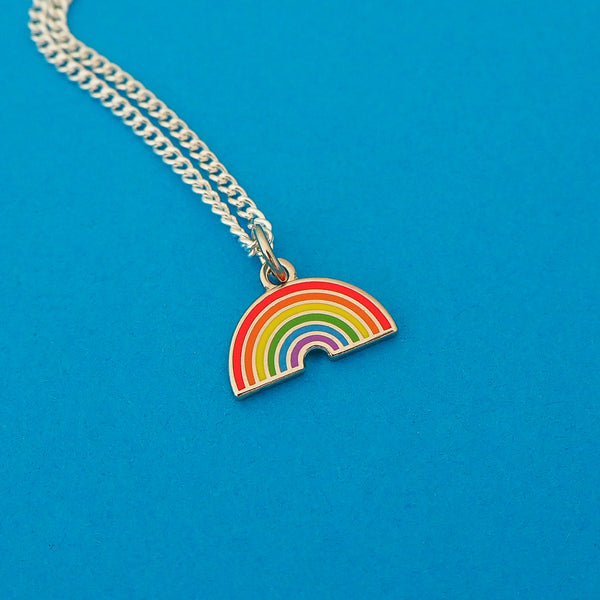 Silver plated curb chain necklace with an enamel charm pendant. Charm depicts a brightly coloured rainbow.