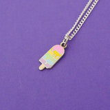Silver-plated curb chain necklace with an enamel charm pendant. Charm is in the shape of an ice lolly. The lolly has horizontal rainbow stripes with the pastel colours dripping into neighbouring sections like it is melting.
