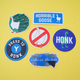 A selection of six brightly coloured vinyl stickers. They are all goose related.